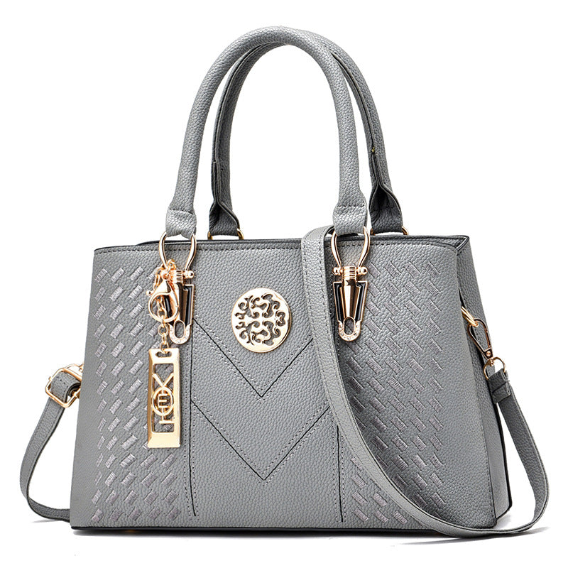Export women's bag 2026new arrivaltrendyfashion hardware pendant decoration high-end women's shoulder crossbody satchel