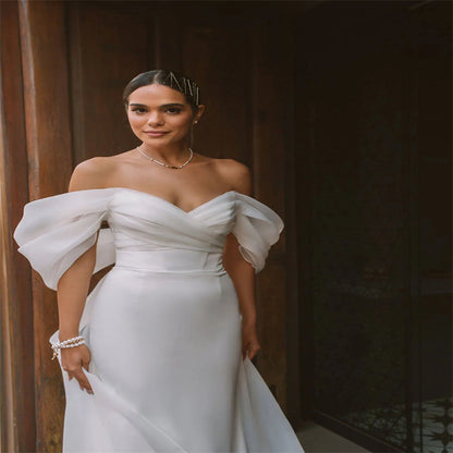 White satin off-the-shoulder mermaid wedding dress - 2026 minimalist, slim-fit bridal gown
