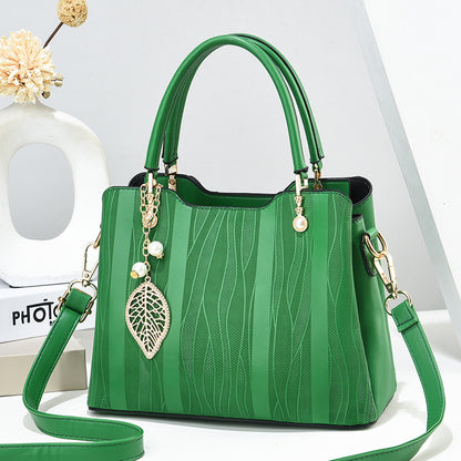 2026 new women's handbag wholesale: fashionable leaf charm, solid color, large capacity, minimalist shoulder bag, stylish tote, crossbody bag