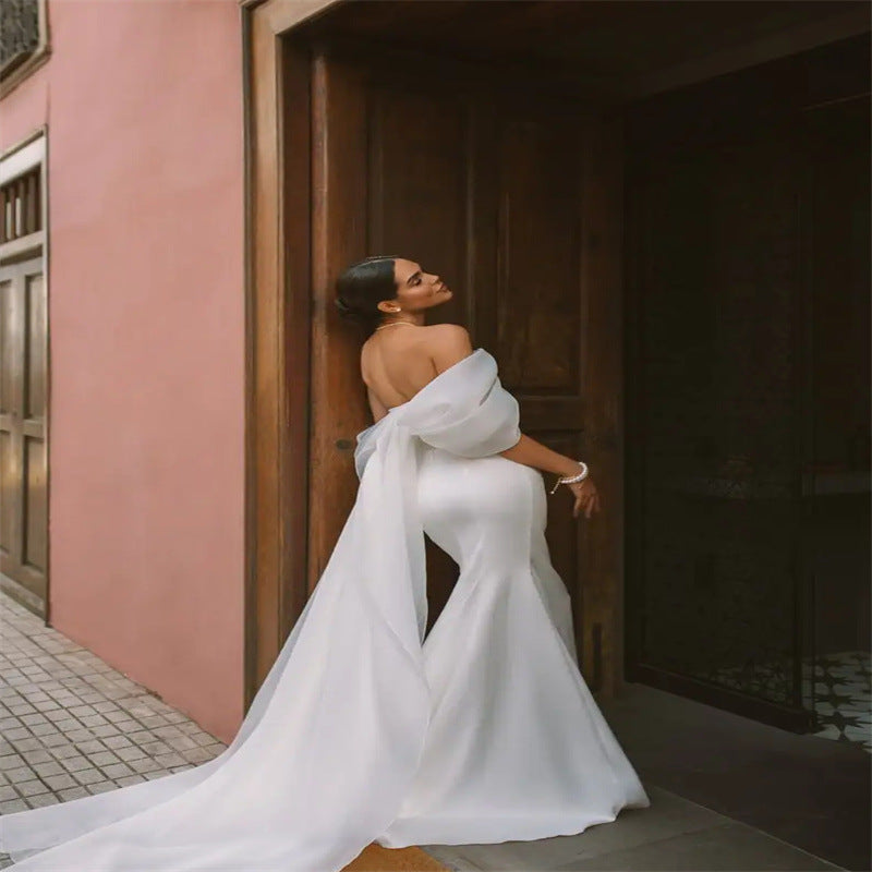 White satin off-the-shoulder mermaid wedding dress - 2026 minimalist, slim-fit bridal gown