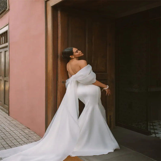 White satin off-the-shoulder mermaid wedding dress - 2026 minimalist, slim-fit bridal gown