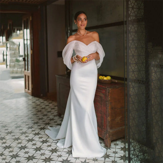 White satin off-the-shoulder mermaid wedding dress - 2026 minimalist, slim-fit bridal gown