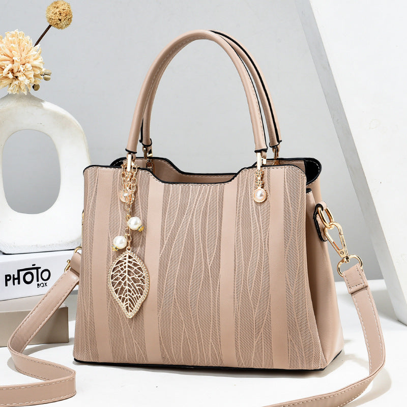 2026 new women's handbag wholesale: fashionable leaf charm, solid color, large capacity, minimalist shoulder bag, stylish tote, crossbody bag