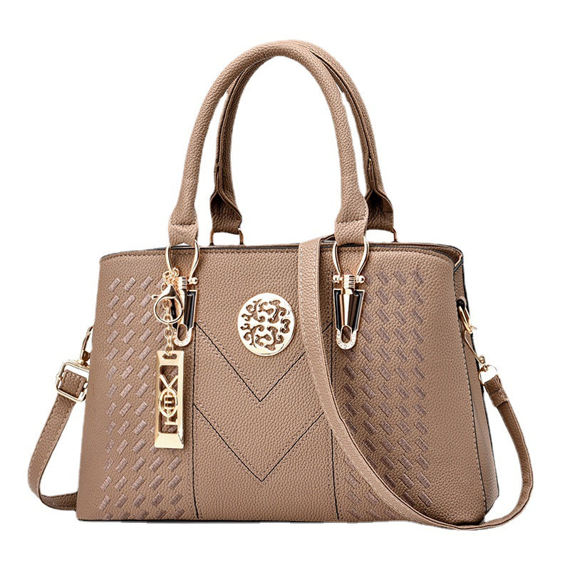 Export women's bag 2026new arrivaltrendyfashion hardware pendant decoration high-end women's shoulder crossbody satchel