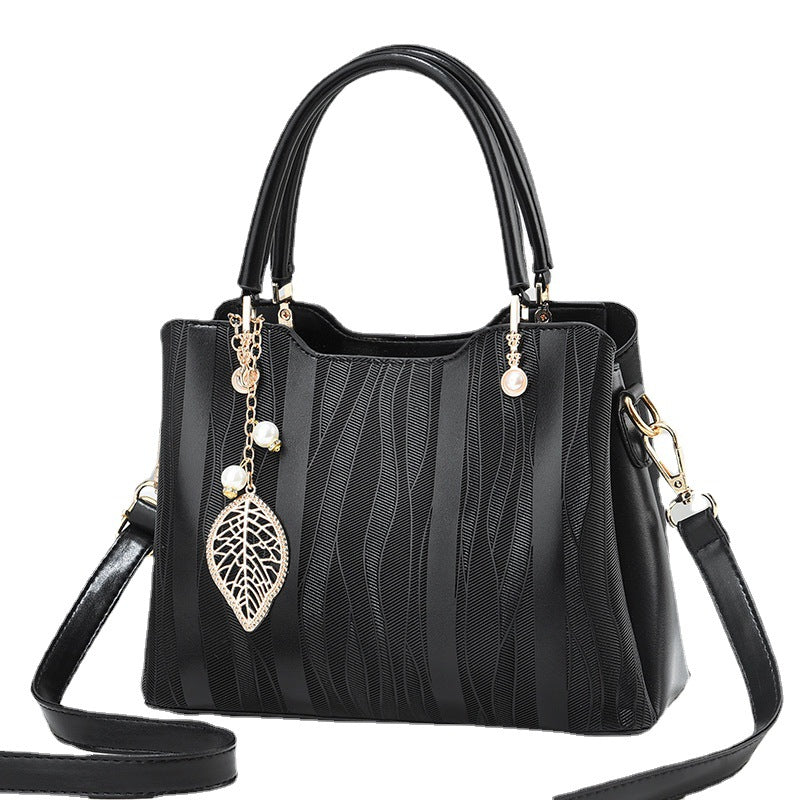 2026 new women's handbag wholesale: fashionable leaf charm, solid color, large capacity, minimalist shoulder bag, stylish tote, crossbody bag